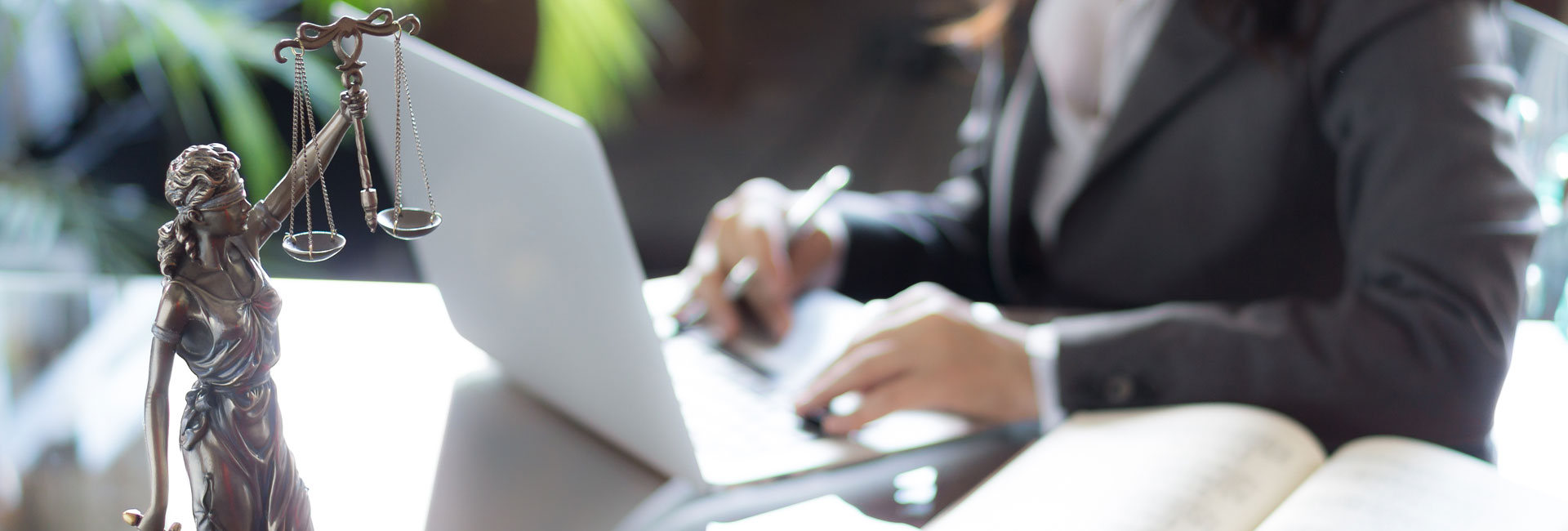 A Lawyer Working on a Laptop